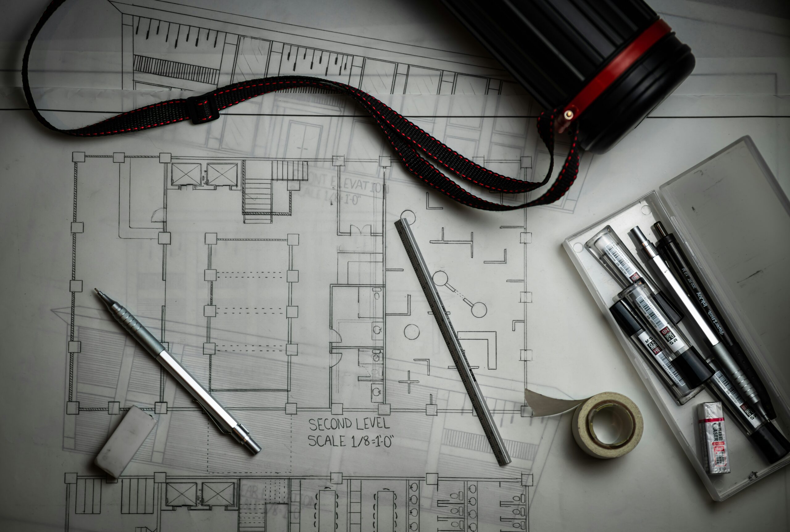 Architectural blueprints and planning tools on a table